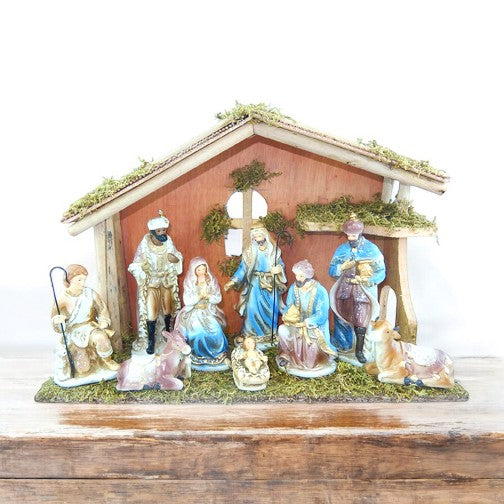 Ceramic Nativity with wooden manger.