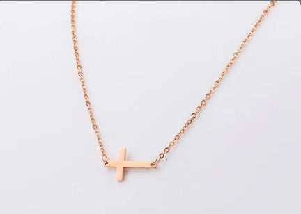 Sideways cross pendant necklace